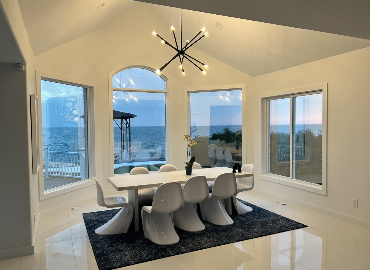 Renovated waterfront dining room with vaulted ceiling, by Mount Vernon Construction