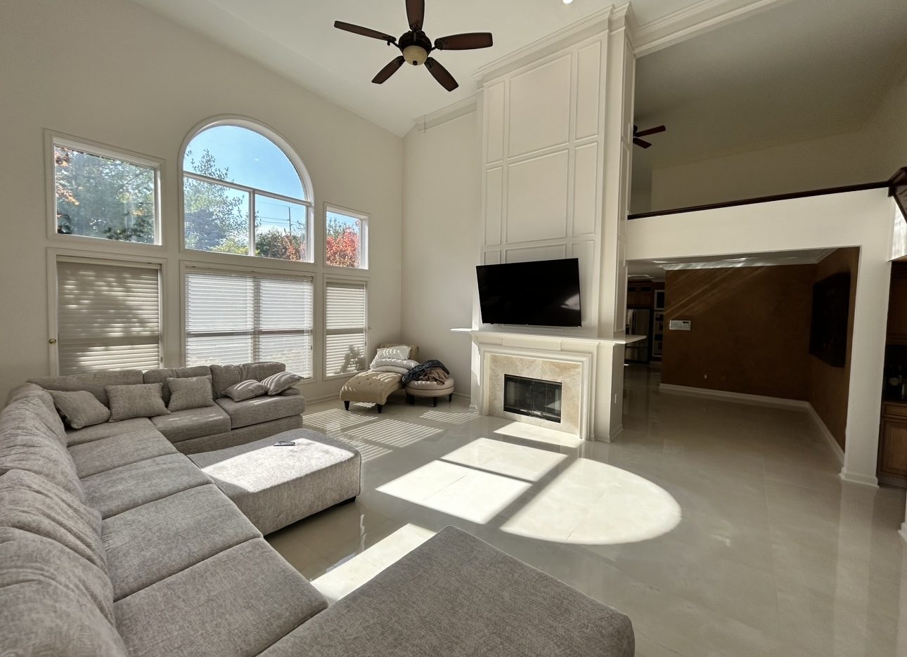 Finished great room with stone fireplace and custom trim, Northville complete remodel by Mount Vernon Construction